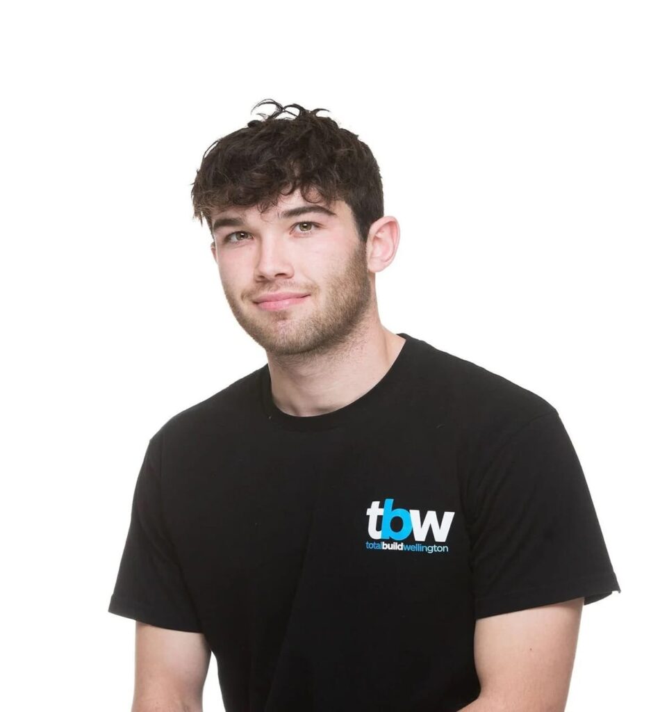 A young building team member in company uniform, reflecting the skills involved in building your home, build your first home planning, and supporting clients through new house build processes and architecture house design projects.