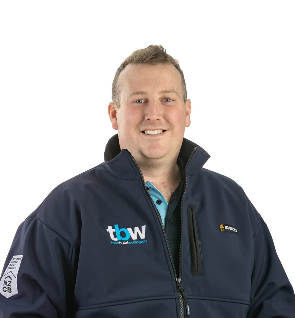 A building industry professional in company uniform, part of a dedicated building team delivering new houses, two story house plans, 2 story house plans, and architecturally designed homes through complete design and build services.